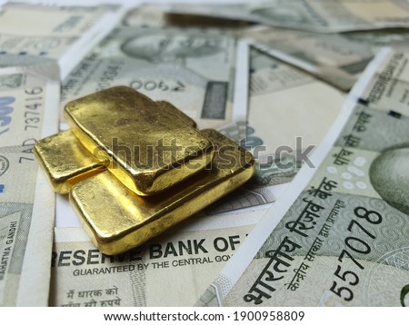 India banknotes and gold bars.Use for website, banner, background and backdrop.