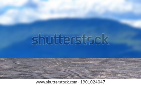 Empty wood table and  green mountain background. blurry view. suitable for your product display