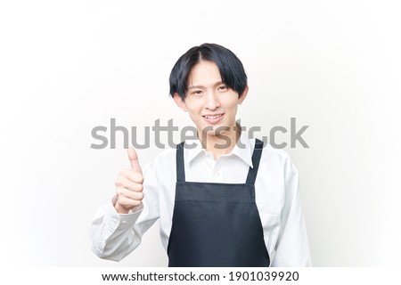 Asian man thumbs up gesture on white