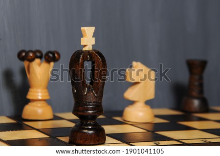 chess pieces on a wooden chessboard - indoor hobby