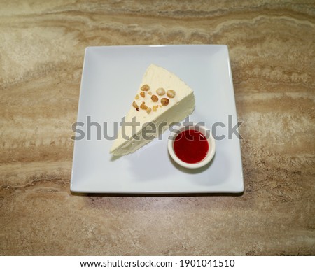A small slice of crust less cheesecake. 