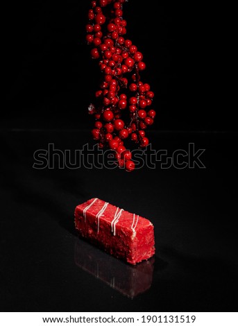 cake sweets pastries beautiful in chocolate glaze red on a black background top view

