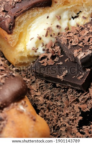Custard cake sprinkled with dark chocolate shavings close-up macro photography