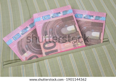 10 euro notes in a stylish garment pocket in close up for money, economic or financial concepts. High quality photo