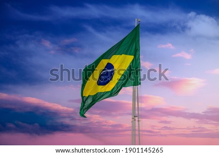 GOIANIA GOIAS BRAZIL - JANUARY 22 2021:  Brazilian flag flying and fluttering in the wind. Royalty-Free Stock Photo #1901145265
