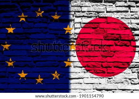 Flag of Europe and Japan on brick wall