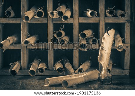 Scribe library full of ancient and valuable manuscripts in wooden box Royalty-Free Stock Photo #1901175136