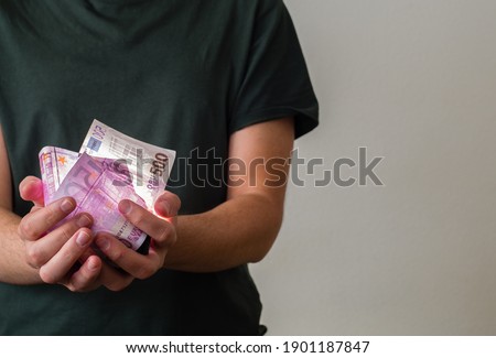 Hand holding money with copys pace. Saving concept