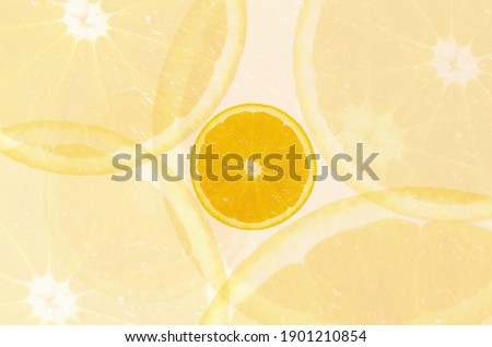 Multiple exposures selective focused photo of half an orange top view to be used as background concept of healthy eating