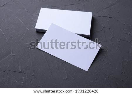 Business card blank on beton rock background. Corporate Stationery, Branding Mock-up. Creative designer desk. Flat lay. Copy space for text. Template for ID