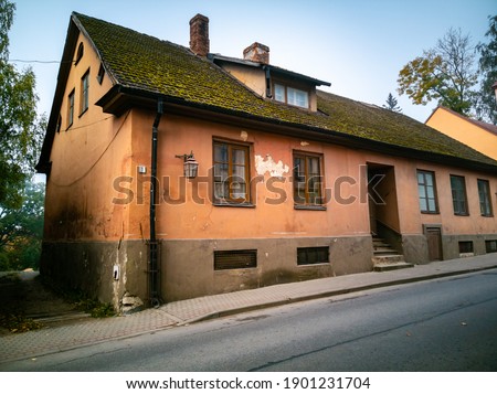 An old, aged, stone house in old European town.
