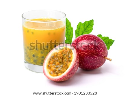 Passionfruit juice in glass and fresh passion fruit with green leaf isolated on white background. 