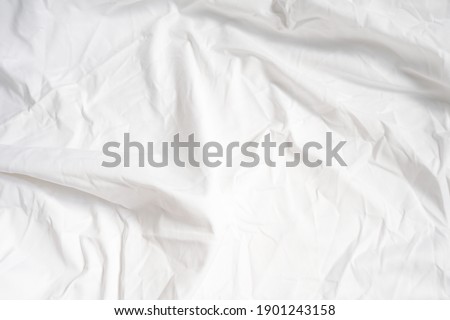 surface of white crumpled fabric for background. Royalty-Free Stock Photo #1901243158