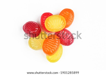 Colorful hard candies isolated on white background. Pile of bonbons
