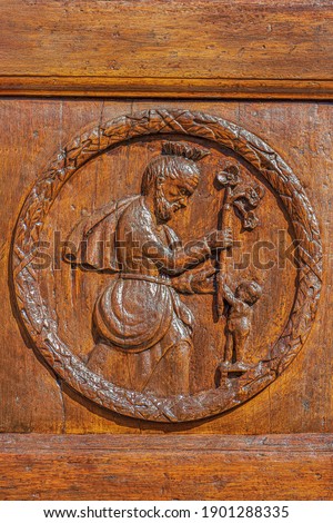 wooden bas-relief of a church door 