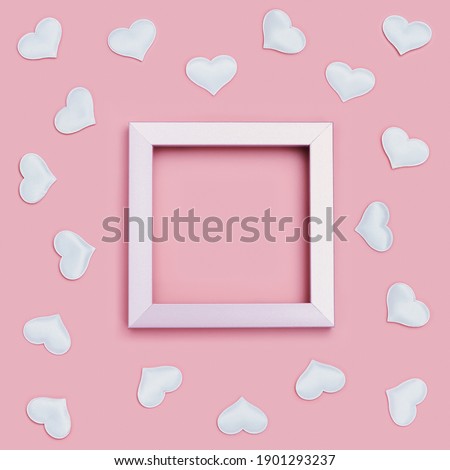 Valentines Day frame with white hearts around on pink colored background. Greeting card or invitation for wedding cards. Pastel colors. Flat lay, top view.