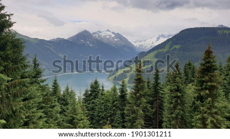 Lake in Alps surrounded by mountains