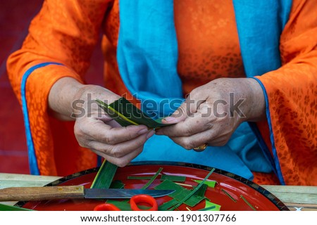 Close up of hand making spousal cake (Phu The) for wedding traditional in Vietnam. Food and culture concept. Selective focus.