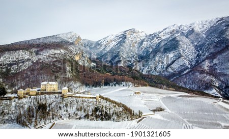 Thun Castle, Italy, Trentino Alto Adige, northern Italy, Europe. Medieval Castle in Italy with garden and defensive walls. Winter landscpe
