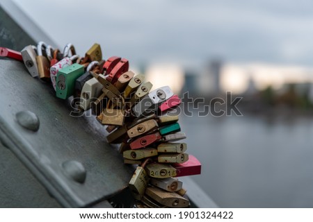 Padlocks on the Love Lock Bridge (Eiserner Steg, Iron Bridge) in Frankfurt am Main, Germany, having various names of love couples engrained in them
