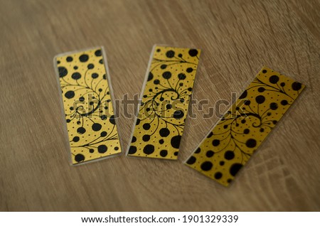 metallic bookmarks on the table