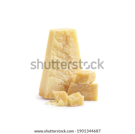 Pieces of delicious parmesan cheese on white background Royalty-Free Stock Photo #1901344687