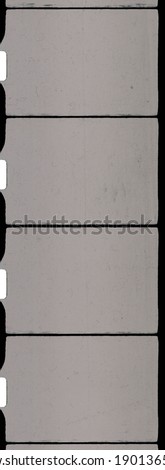 Extreme close up of 8mm movie filmstrip isolated on white background, old scratched homemovie film material.