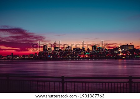 Night panorama of the city of Montreal with the St. Lawrence River, sunset in December