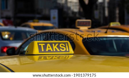 Close up of Istanbul taxi. Many taxis on street. The word "taksi" translated from Turkish means "taxi".