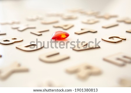 wooden alphabet soup including the word "love"