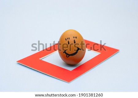 an Easter egg in a red frame. The concept of Easter