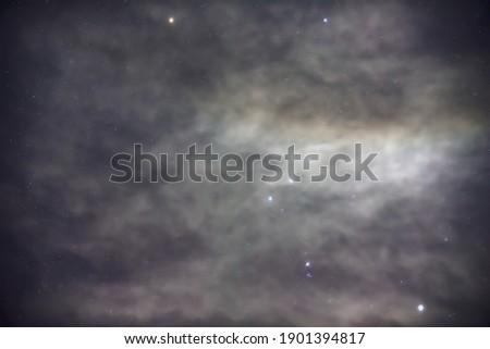 Orion constellation and Orion nebula in the foggy night.