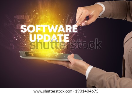 Close-up of a touchscreen with SOFTWARE UPDATE inscription, innovative technology concept