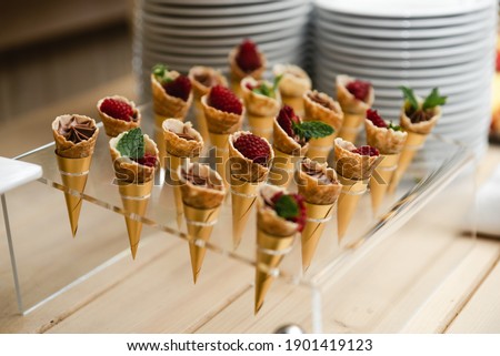 wedding candy bar. a festive table filled with different types of sweets. a wedding treat. buffet with a variety of delicious food