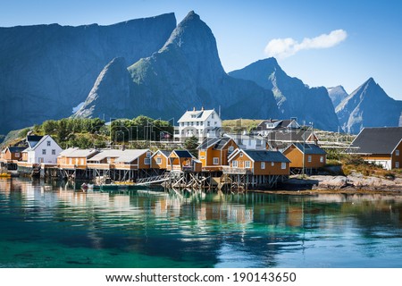 Typical Norwegian fishing village with traditional red rorbu huts, Reine, Lofoten Islands, Norway Royalty-Free Stock Photo #190143650
