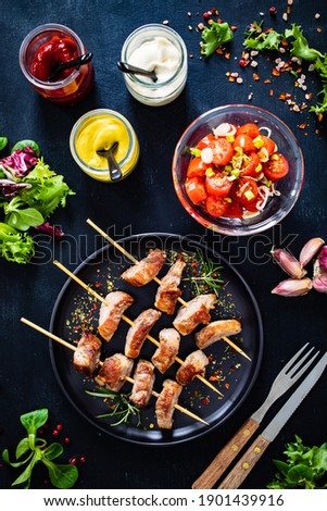  Skewers - grilled pork meat with vegetables on wooden background table 