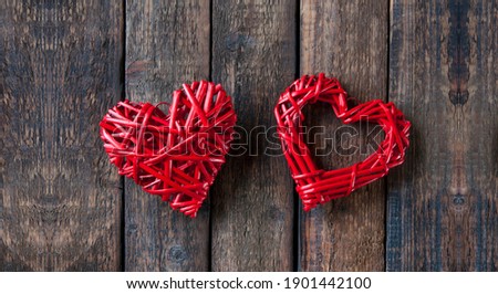 Two red hearts on a wooden background. Valentine's Day. Love