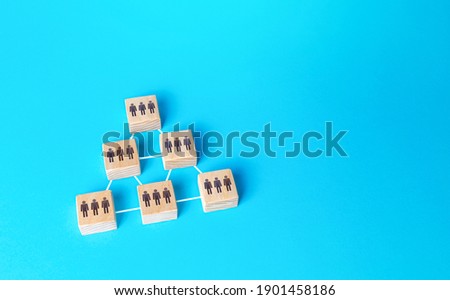 The people on the blocks are grouped together and form a complex organization. Combining efforts to achieve goal. Business team formation. Self organized community. Performance and flexibility Royalty-Free Stock Photo #1901458186