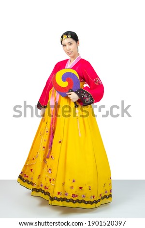 The woman wearing colorful Hanbok, Korean traditional dress on white background isolated.
 Royalty-Free Stock Photo #1901520397