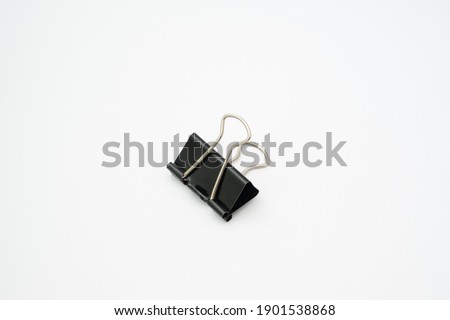 Paper clip black color on white background.Office tool on white background.Items used to clip paper in the office