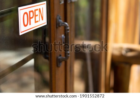 The sign is open at the door of the house, Welcome symbol.