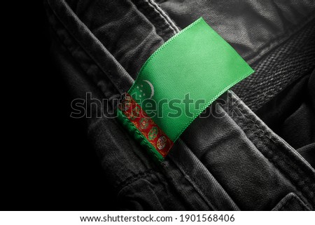 Tag on dark clothing in the form of the flag of the Turkmenistan