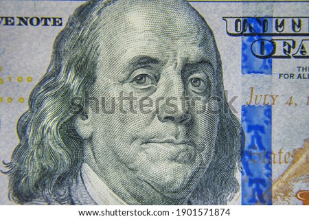 Closeup  banknotes hundred dollar bills. 100 dollars banknote closeup macro fragment.