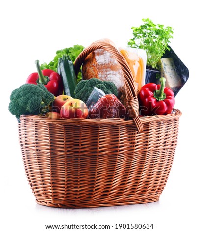 Wicker basket with assorted grocery products isolated on white background Royalty-Free Stock Photo #1901580634
