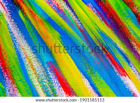 Background from different strokes of red, yellow, green and blue paint with brush close-up. Bright colorful backdrop of colored brush lines. Mixing color streaks of paint with cracked and scratched. Royalty-Free Stock Photo #1901585113