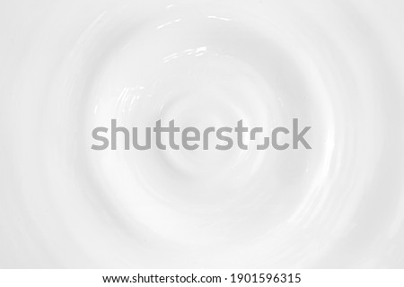 real photo of milk circle ripple, drop of splash water waves, top view, texture surface for template. Royalty-Free Stock Photo #1901596315