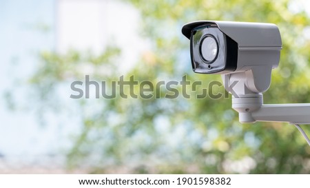 IP CCTV camera install by have water proof cover to protect camera with home security system concept with blur background. Royalty-Free Stock Photo #1901598382
