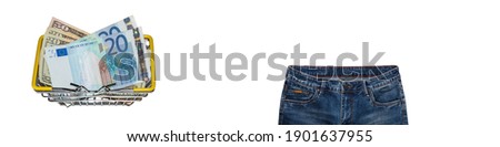 Waist and front pockets part of blue jeans, dollar and euro bills mixed up in shopping basket on white background. Isolated. Banner size. Copy space. Shopping, trade, sale, store concepts.