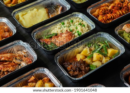 Business lunch in eco plastic container ready for delivery.Top view. Office Lunch boxes with food ready to go. Food takes away. Catering, brakfast.  Royalty-Free Stock Photo #1901641048