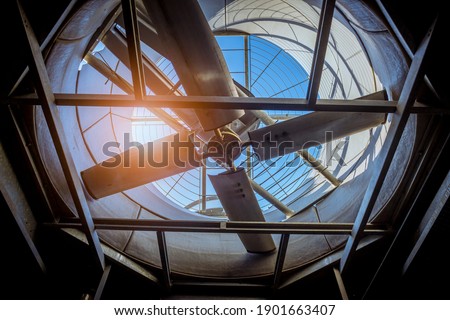 Cooling tower air conditioner circle of fan electric control HVAC in industry plantation. Royalty-Free Stock Photo #1901663407